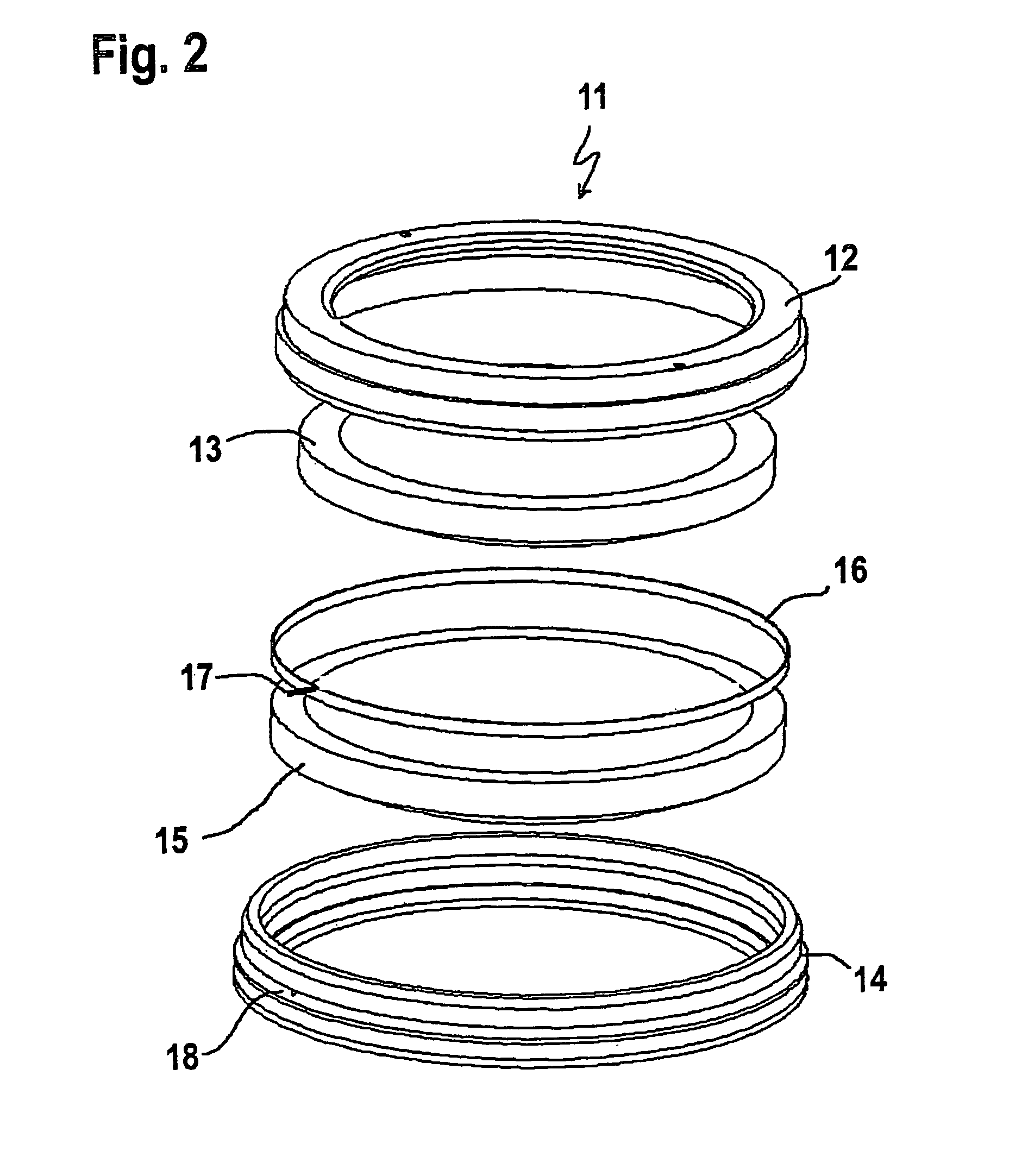 Device for layerwise manufacturing of a three-dimensional object