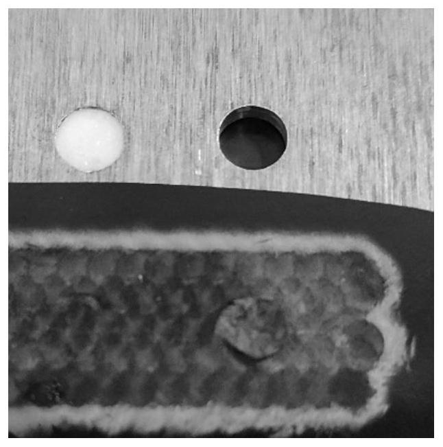 Hot melt adhesive assisted laser shock peening method for small hole of airplane structural part