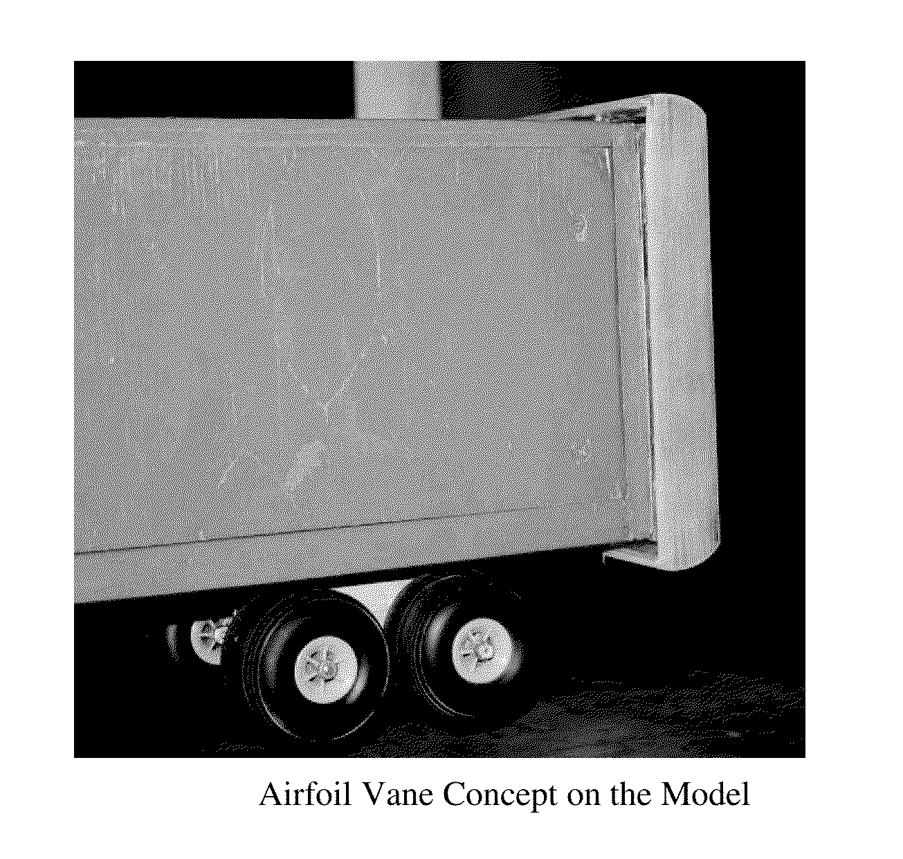 Drag reduction of a tractor trailer using guide vanes