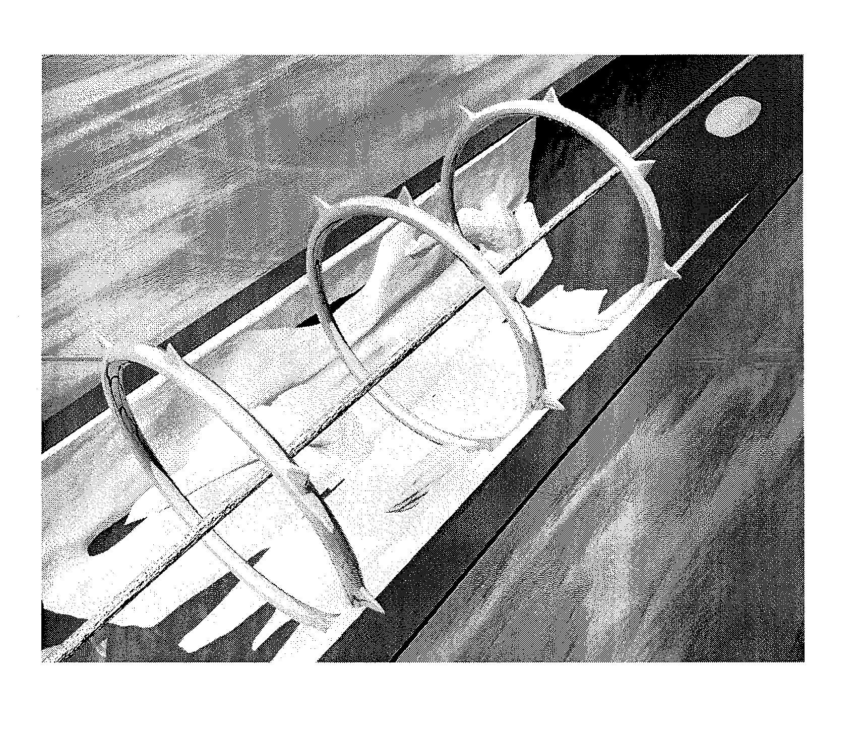 Device and method for tacking plaque to blood vessel wall