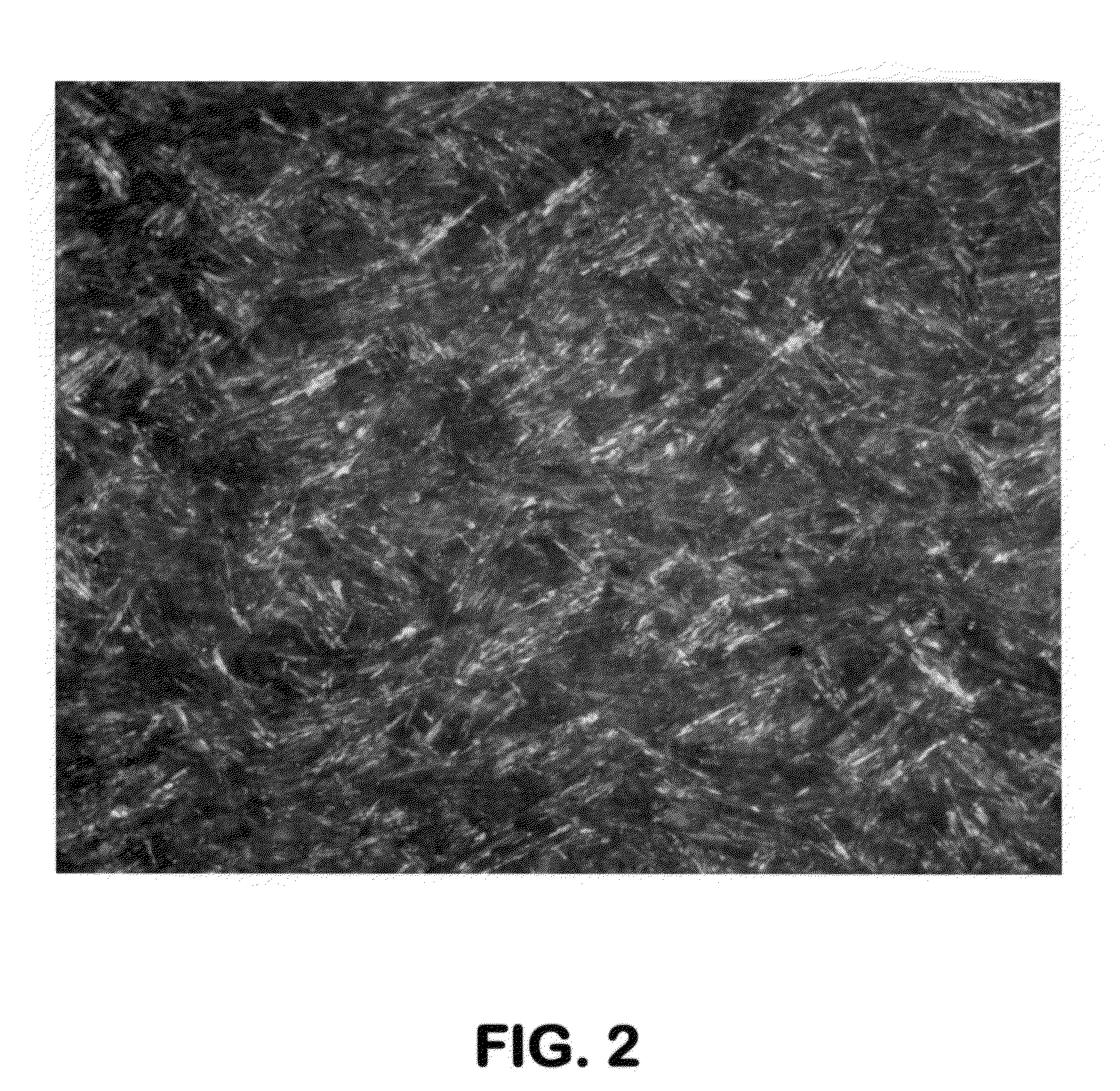 Delayed coking process for producing free-flowing coke using low molecular weight aromatic additives