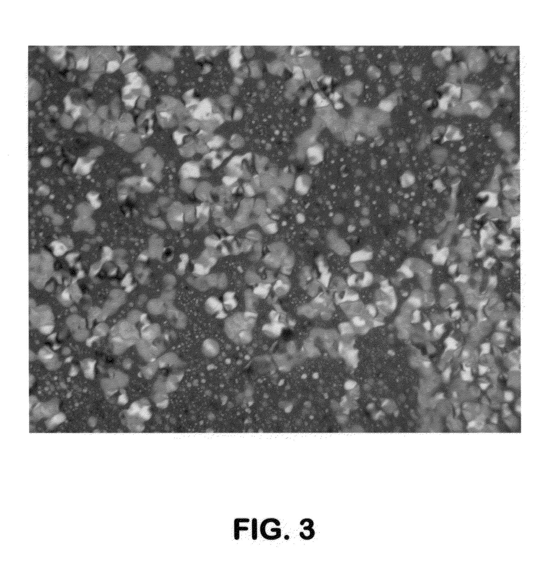 Delayed coking process for producing free-flowing coke using low molecular weight aromatic additives