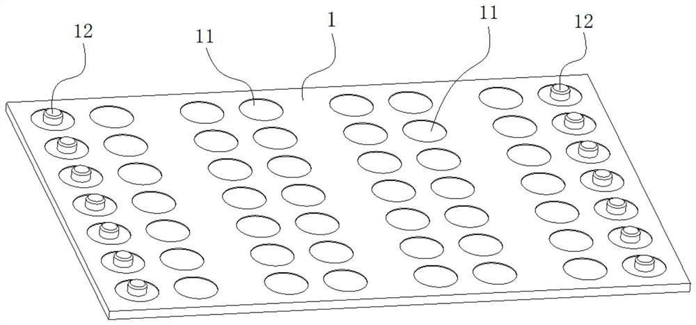 An assembly device for a valve spring base