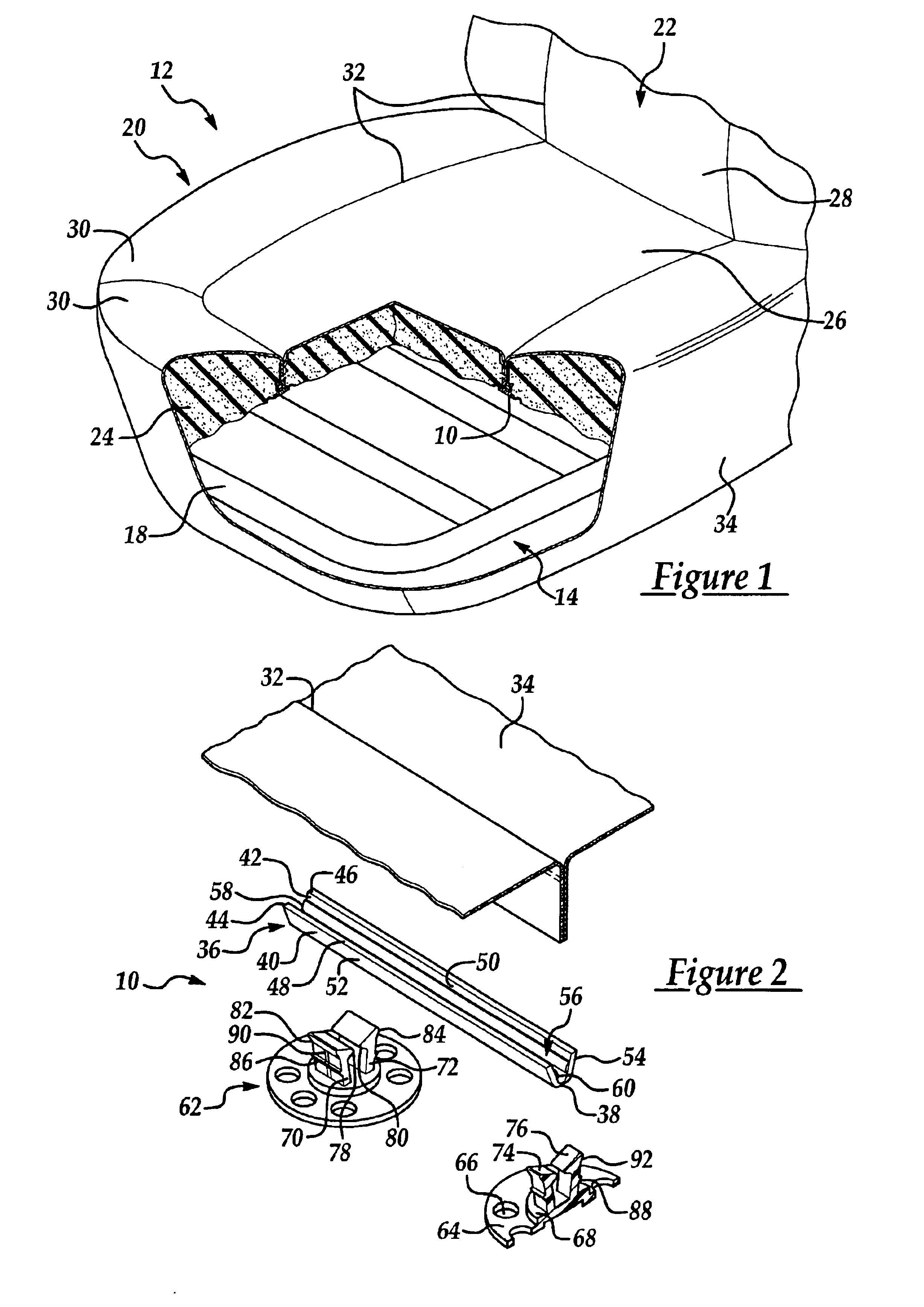 Attachment assembly for securing trim material to the padding of a vehicle seat