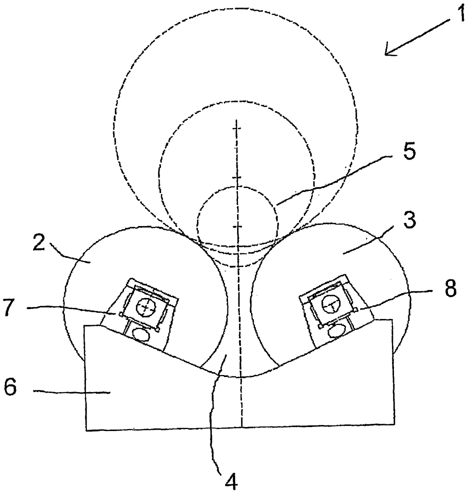 Device and method for winding a web of material