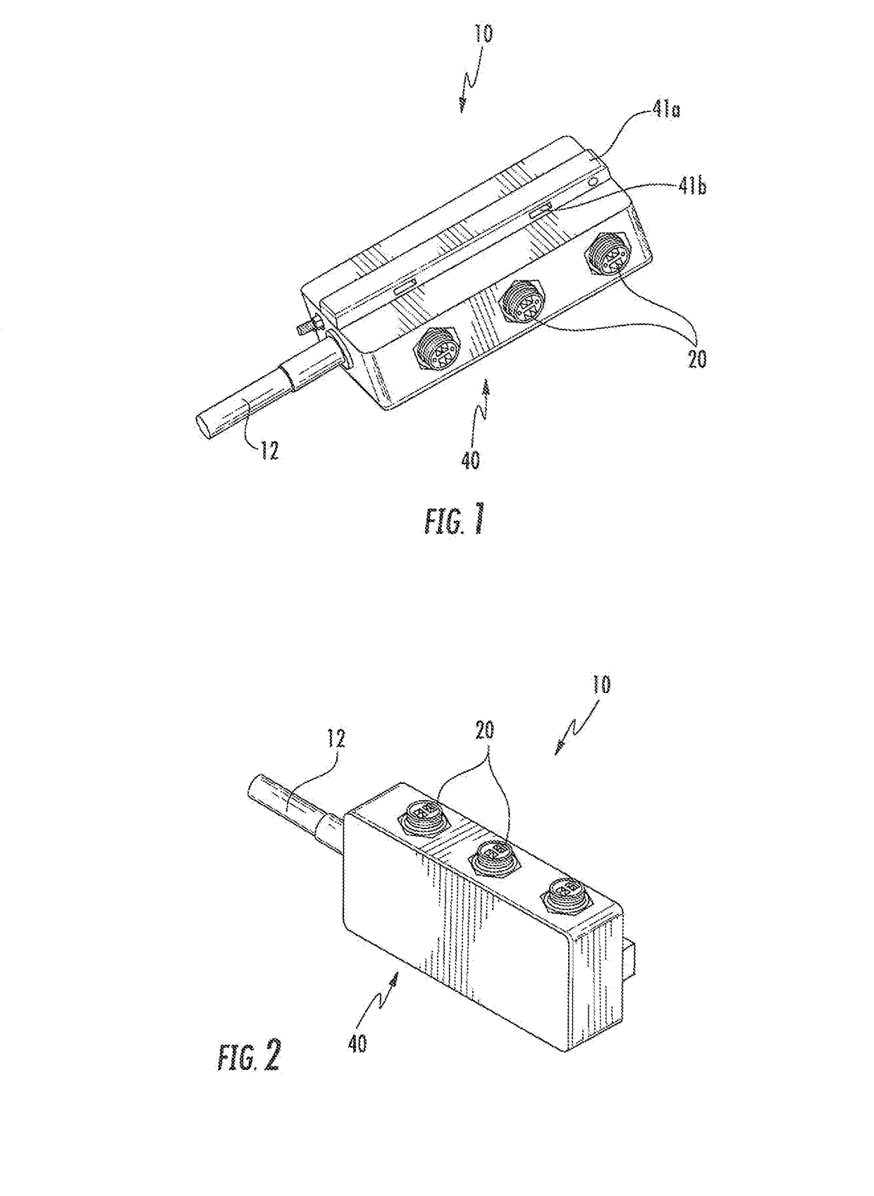 Device for distributing hybrid cable and transitioning from trunk cable to jumper cable with overvoltage protection