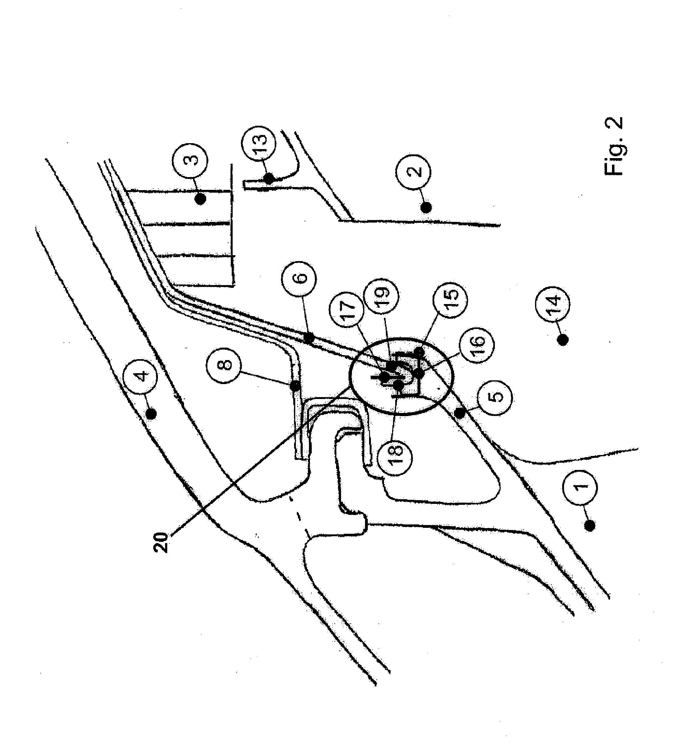 Seal carrier attachment for a turbomachine