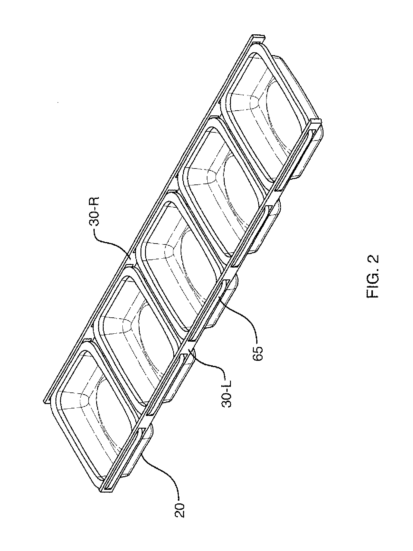 Package conveyor for continuous process microwave applicator