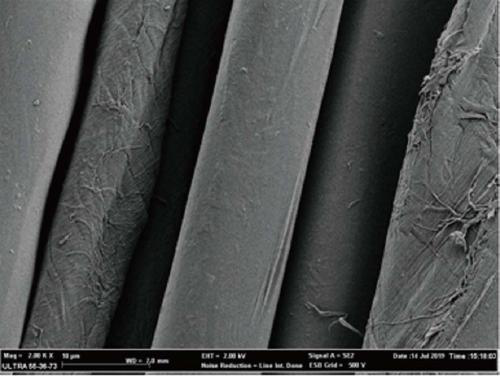 Textile surface adhesive staining nuclide detergent and preparation method thereof