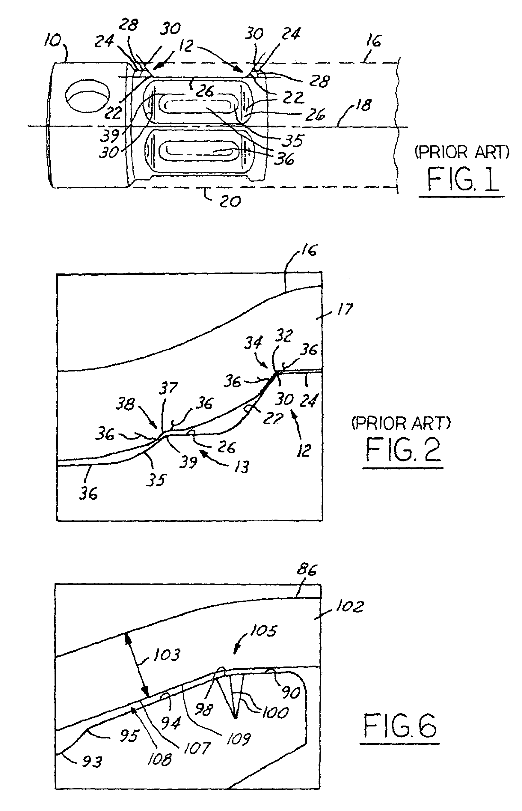 Low chamfer angled torque tube end fitting with elongated overflow groove