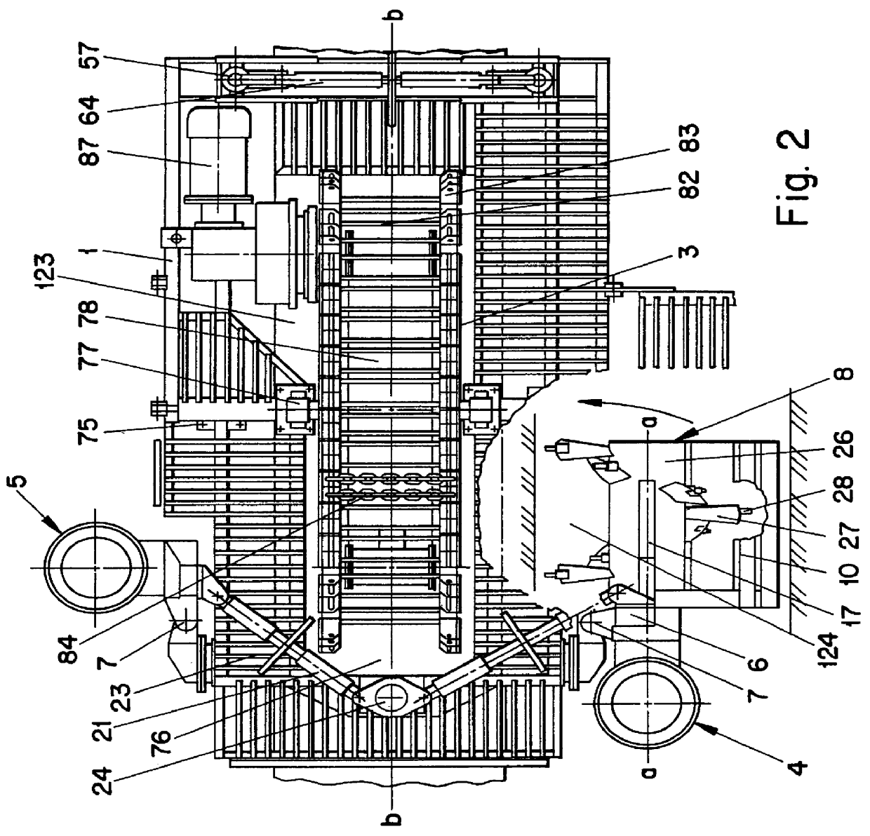 Machine for digging under pipes and caterpillar traction device