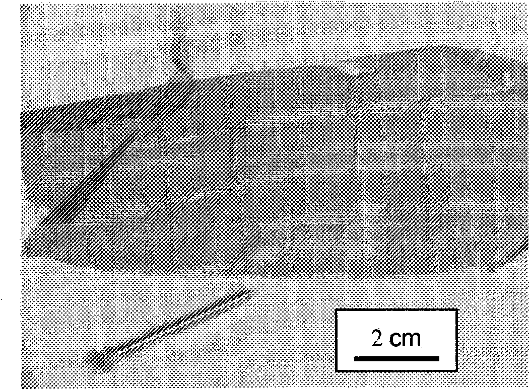 Microstructured material and process for its manufacture