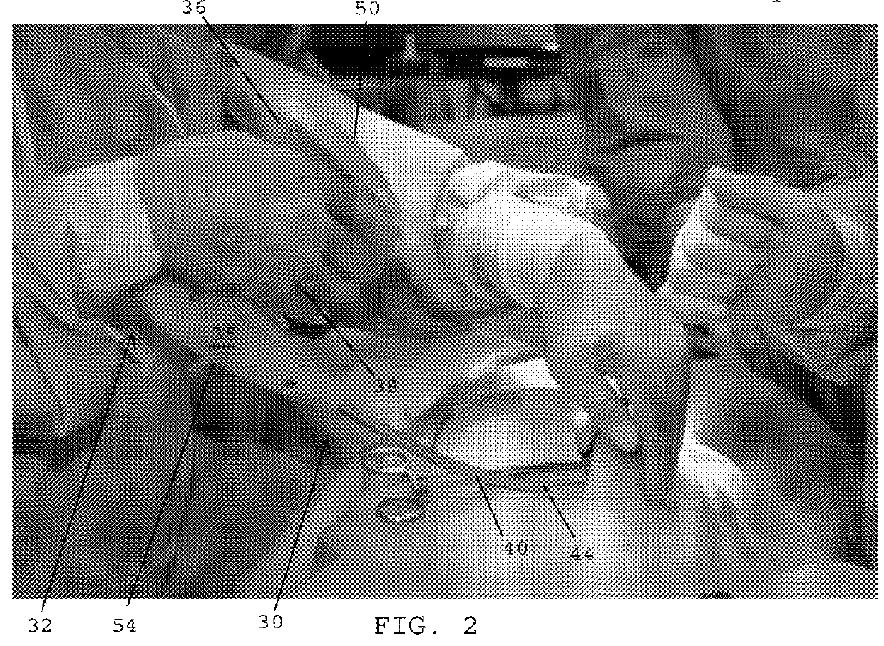 Applicator instruments with inverted handles and triggers, curved shafts, and visible orientation indicia