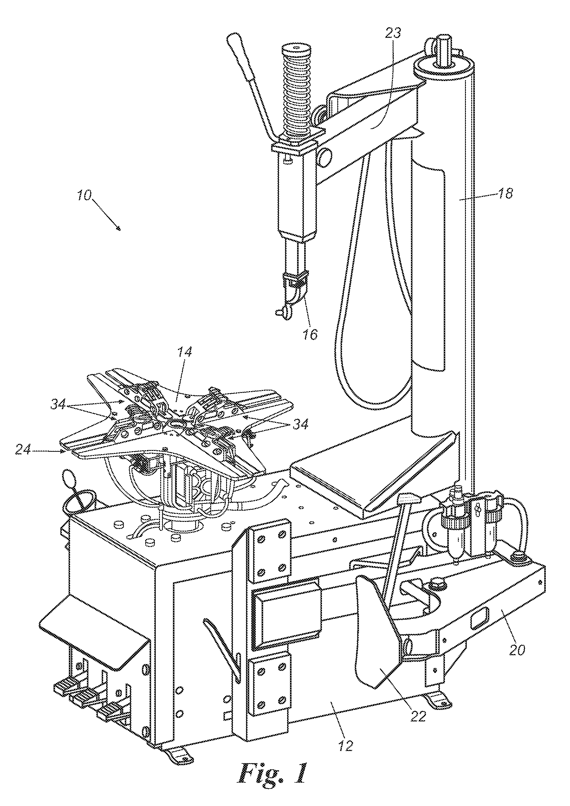 Lamintated clamp for a tire changer