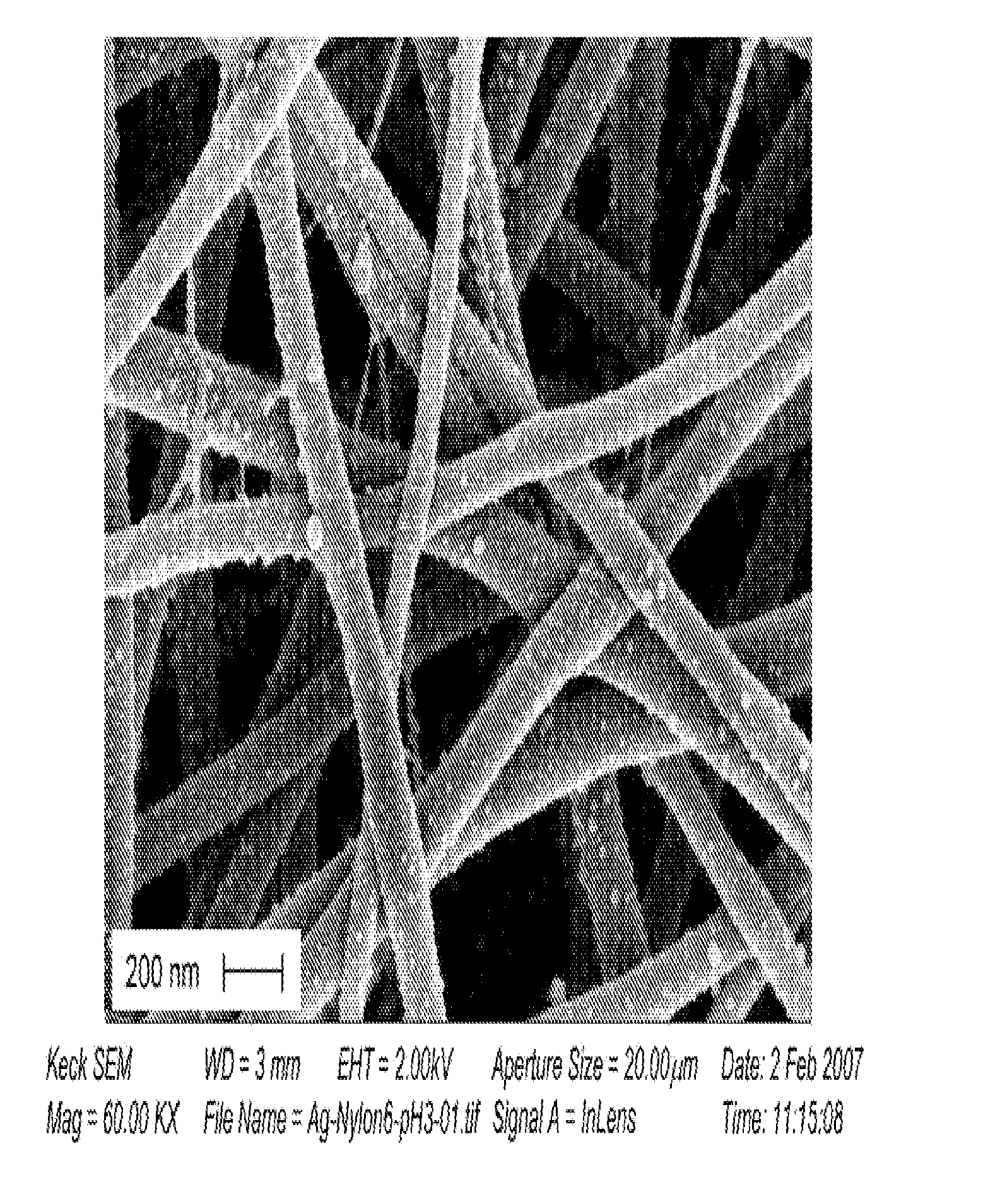 Conformal particle coatings on fibrous materials