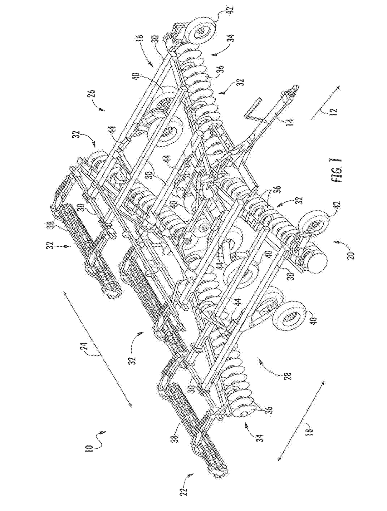 System and method for reducing soil and crop residue accumulation relative to ground-engaging tools of a tillage implement