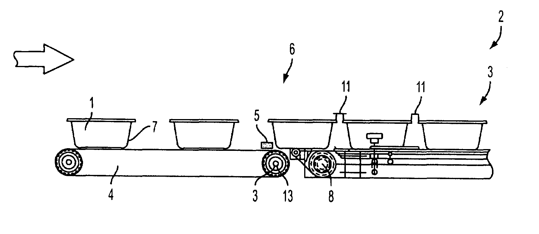 Machine for sealing containers by applying a covering film