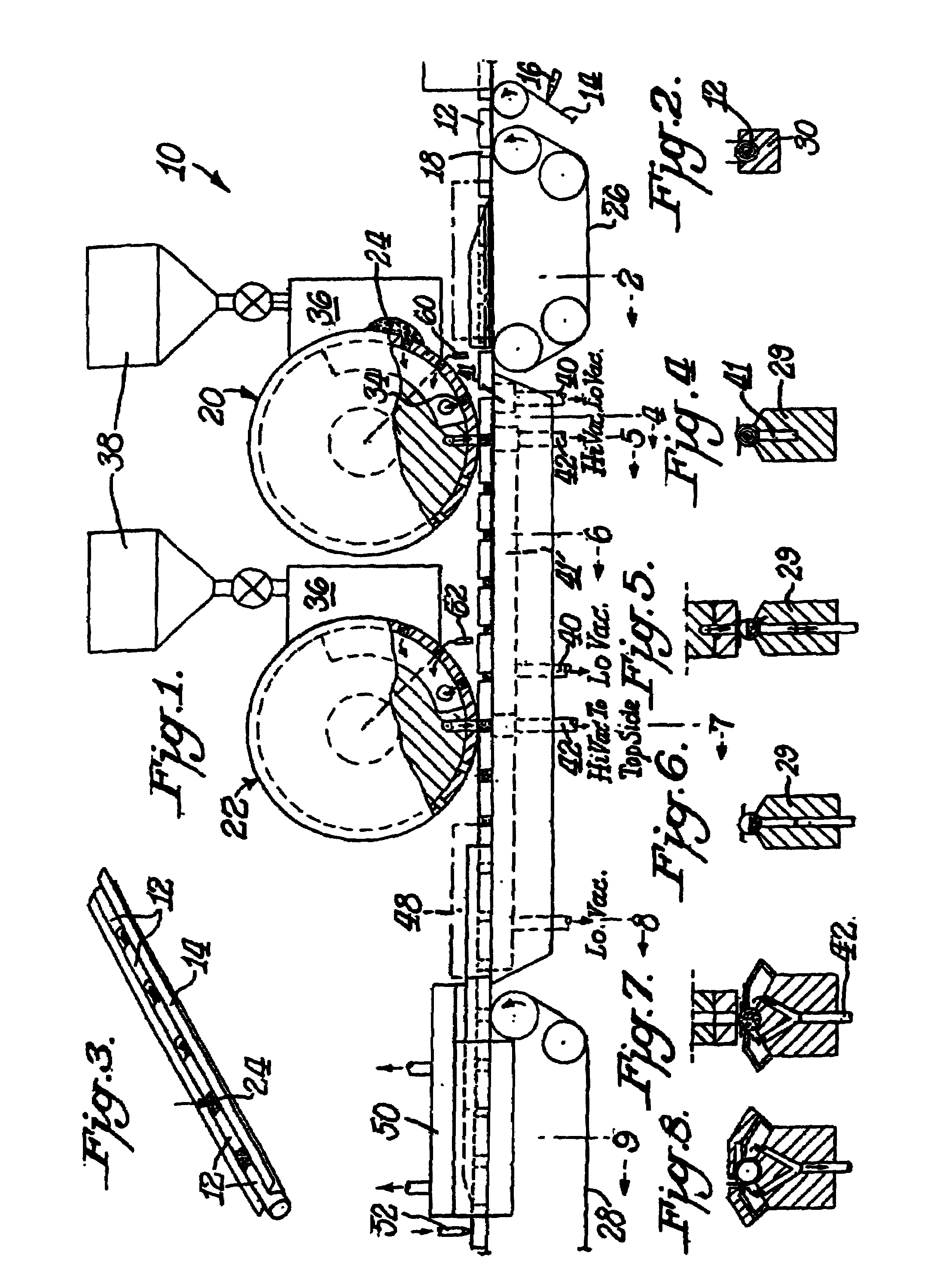 Dual station applicator wheels for filling cavities with metered amounts of particulate material