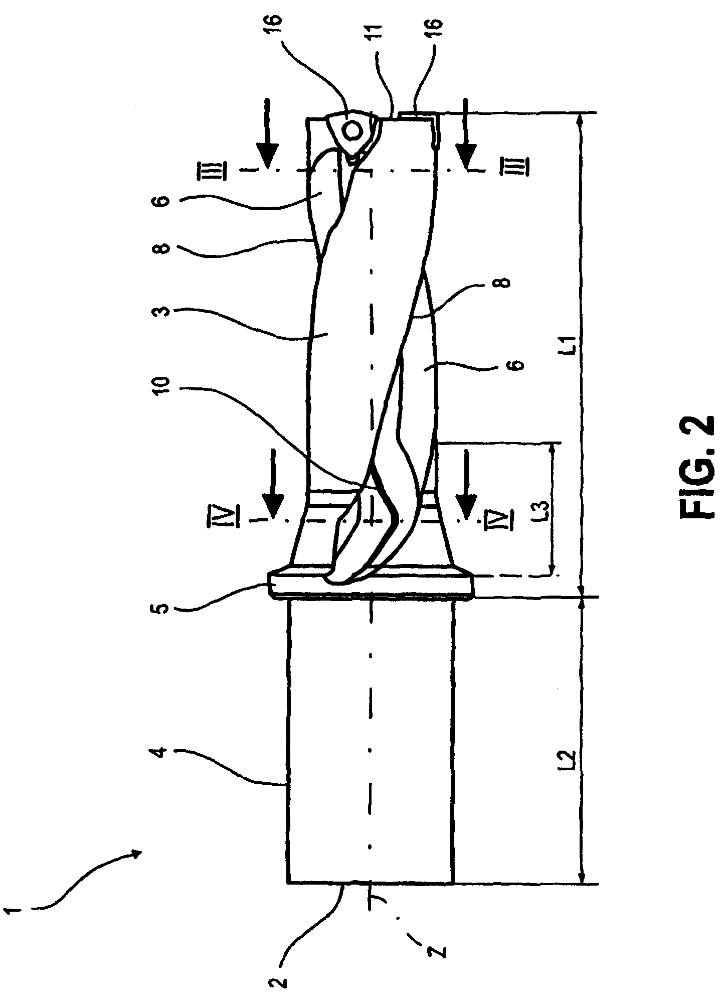 Twist drill having at least two cutting inserts at the tip each with its own J-shaped chip guiding flute and a method for the production thereof