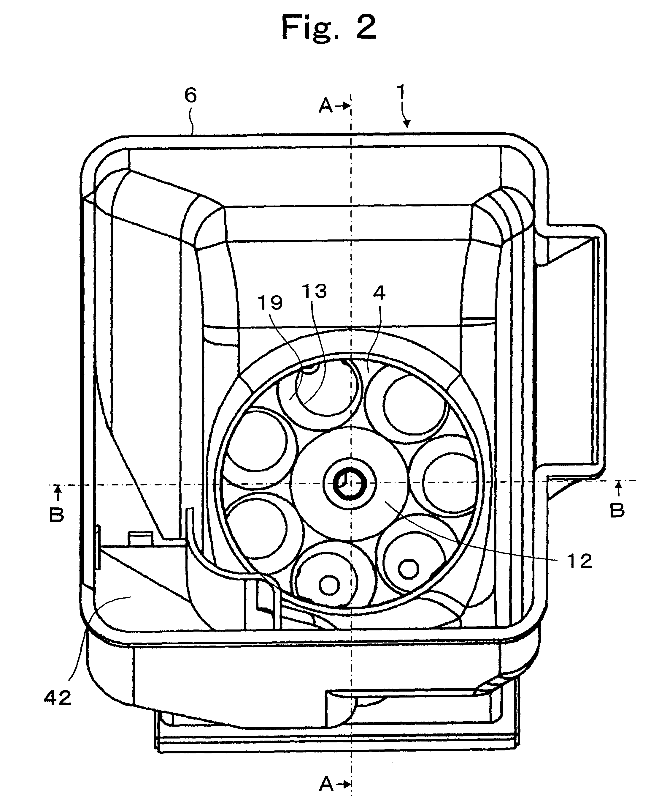 Token dispensing device with decreased loading on a token dispensing disk