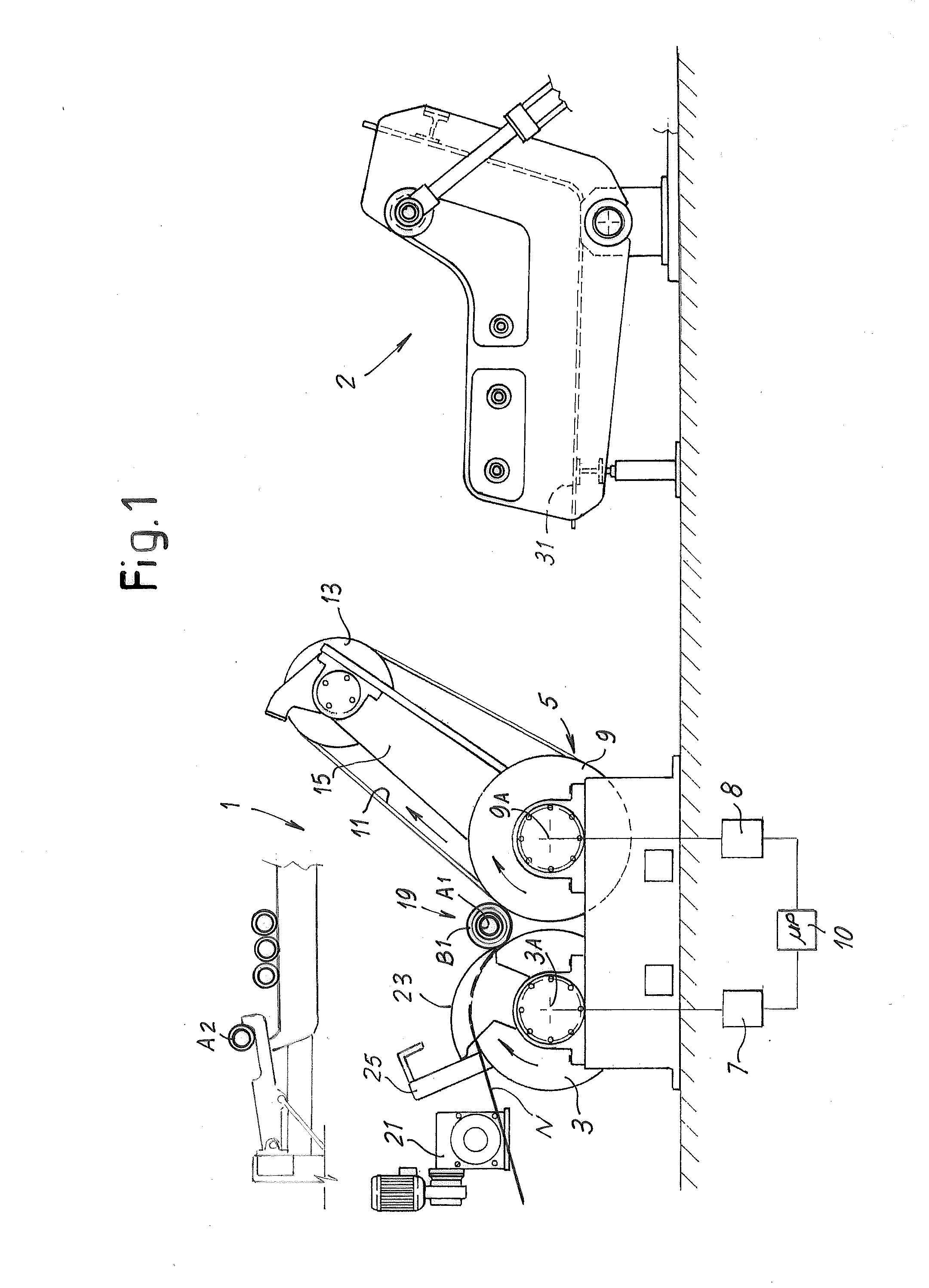 Machine and method for winding reels of web material