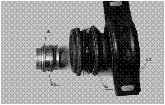 Agricultural vehicle gearbox with gap bridge bearing