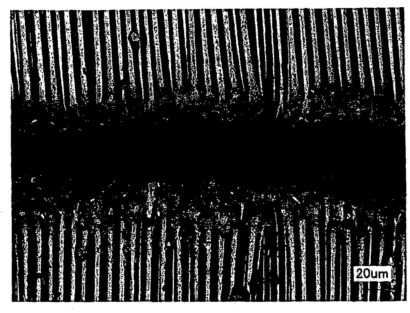 Method of laser machining of fiber-reinforced composite material and product made by the method