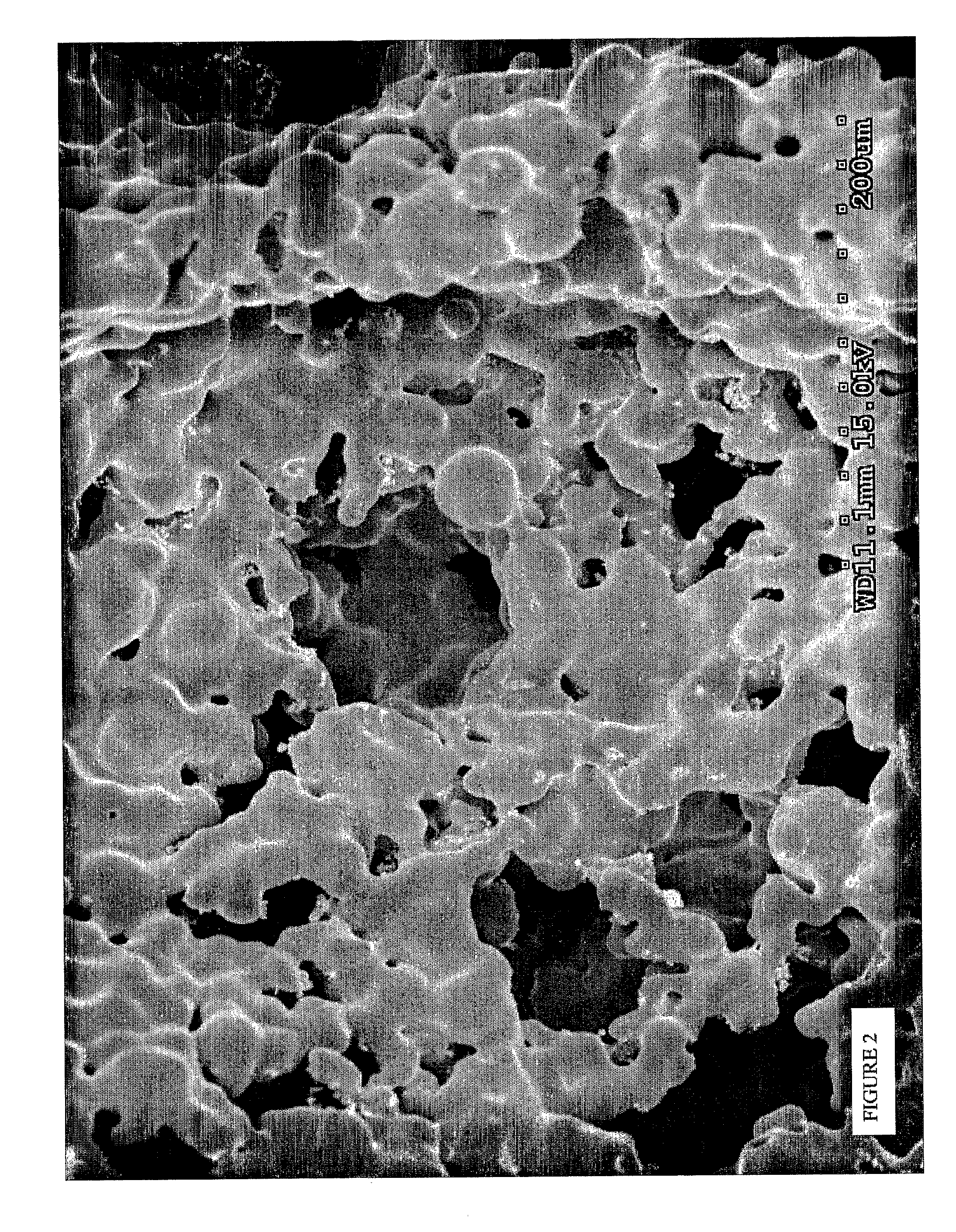 Open cell porous material and method for producing same