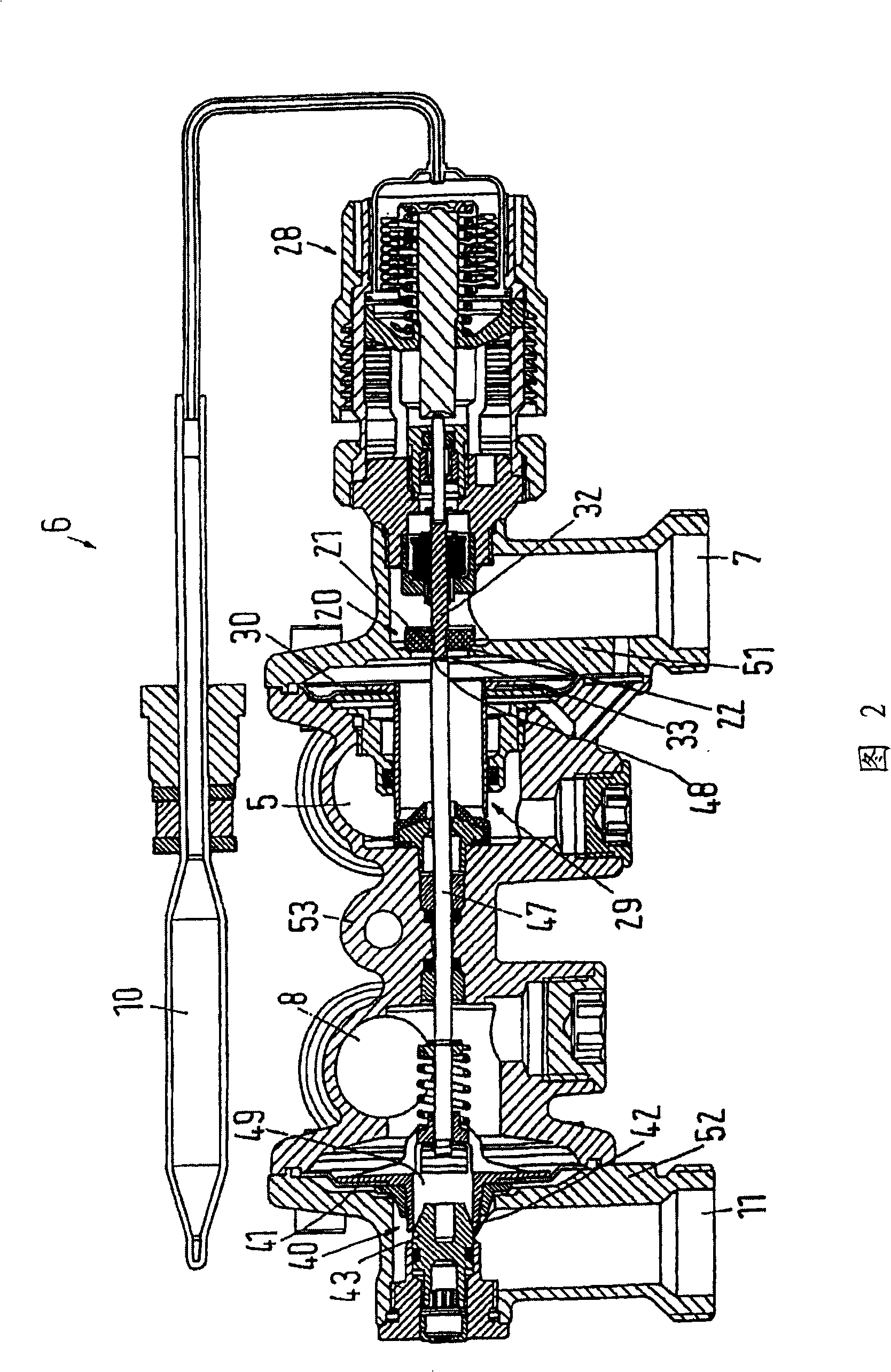 Valve assembly for connecting a heat exchanger of a hot water discharging device to a district heating system