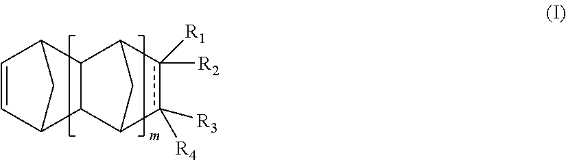 Two component mass polymerizable compositions containing polycycloolefin monomers and organoruthenium carbide precatalyst