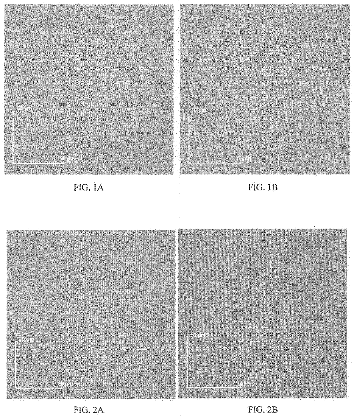 Two component mass polymerizable compositions containing polycycloolefin monomers and organoruthenium carbide precatalyst