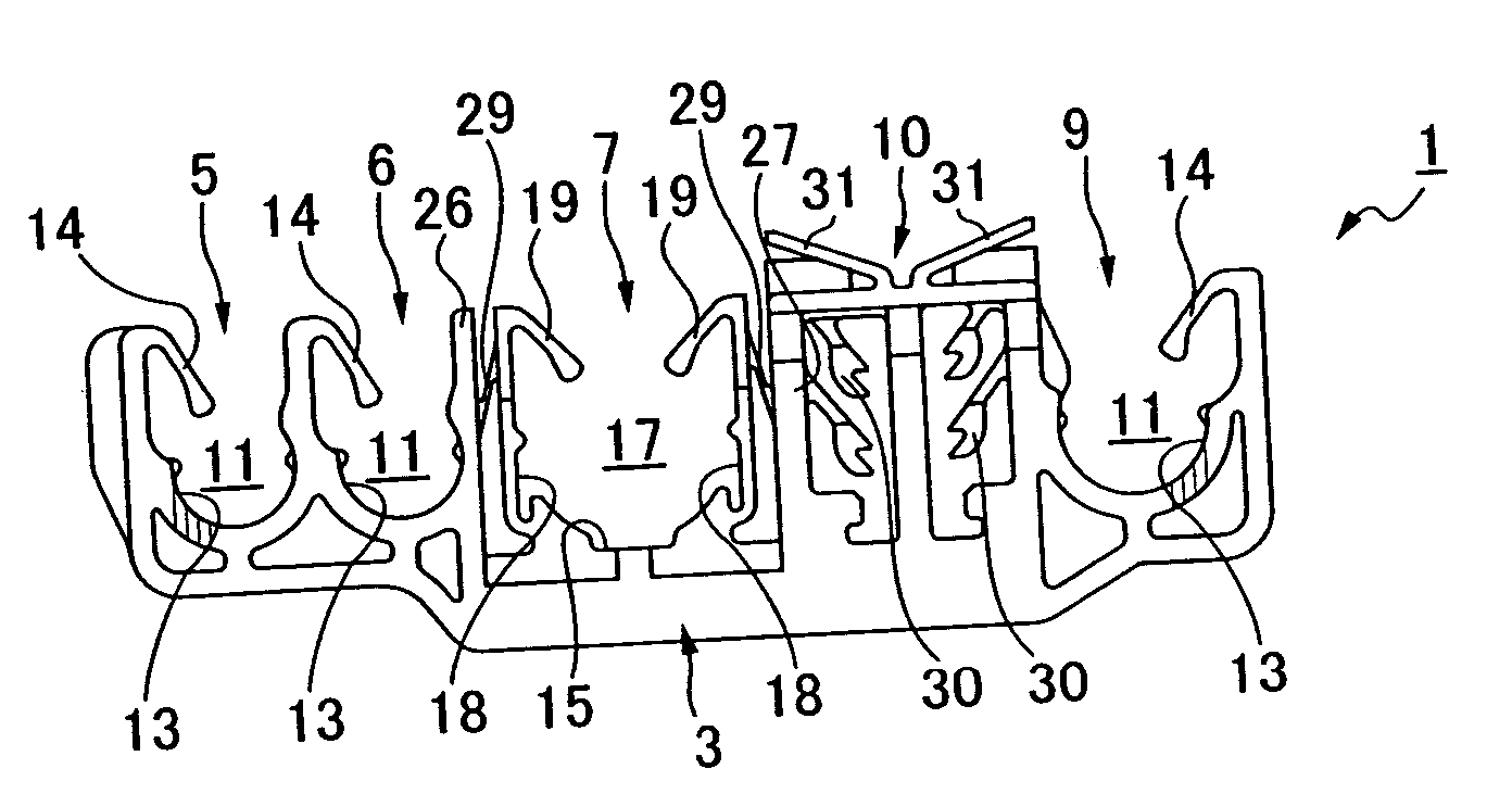 Vibration suppressing clamp for pipe or the like