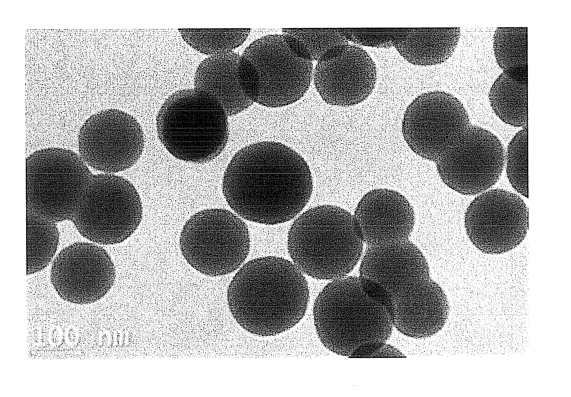 Yttrium hydroxycarbonate modified with heterogeneous metal, method of preparing the same, and adsorbent and filter device including the same