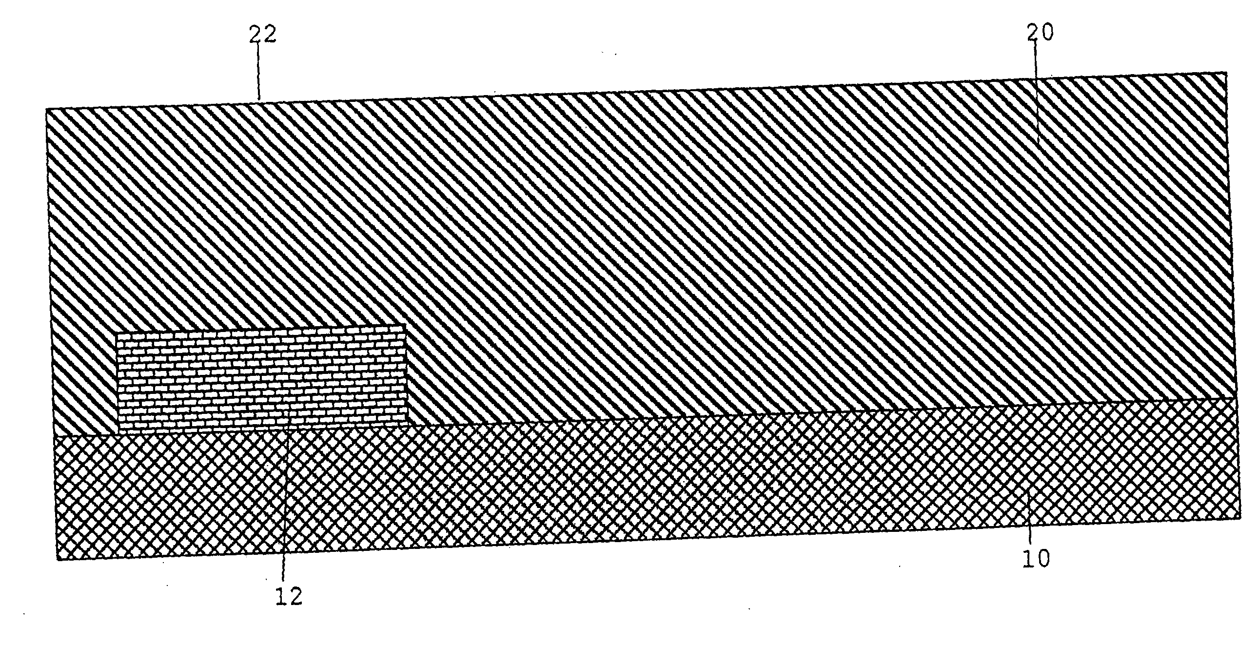 Method of producing a capacitor in a dielectric layer