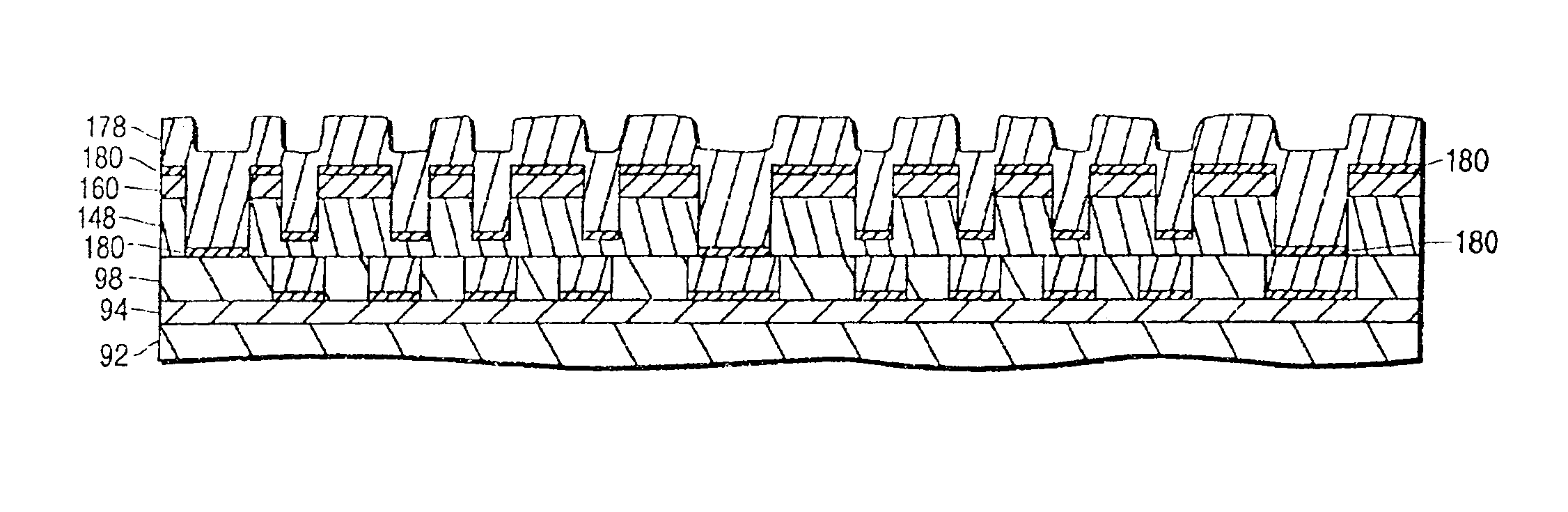 Magnetic head induction coil fabrication method utilizing aspect ratio dependent etching