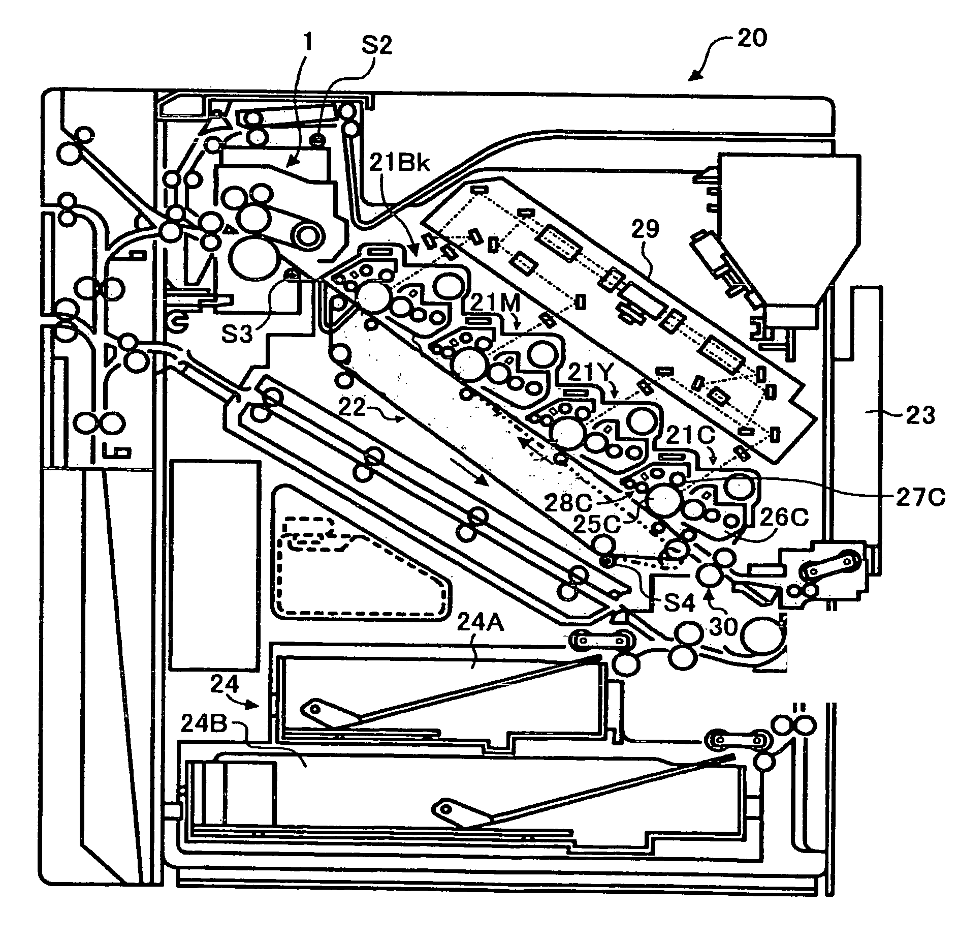 Image forming device with a control means to correct the fixing control temperature