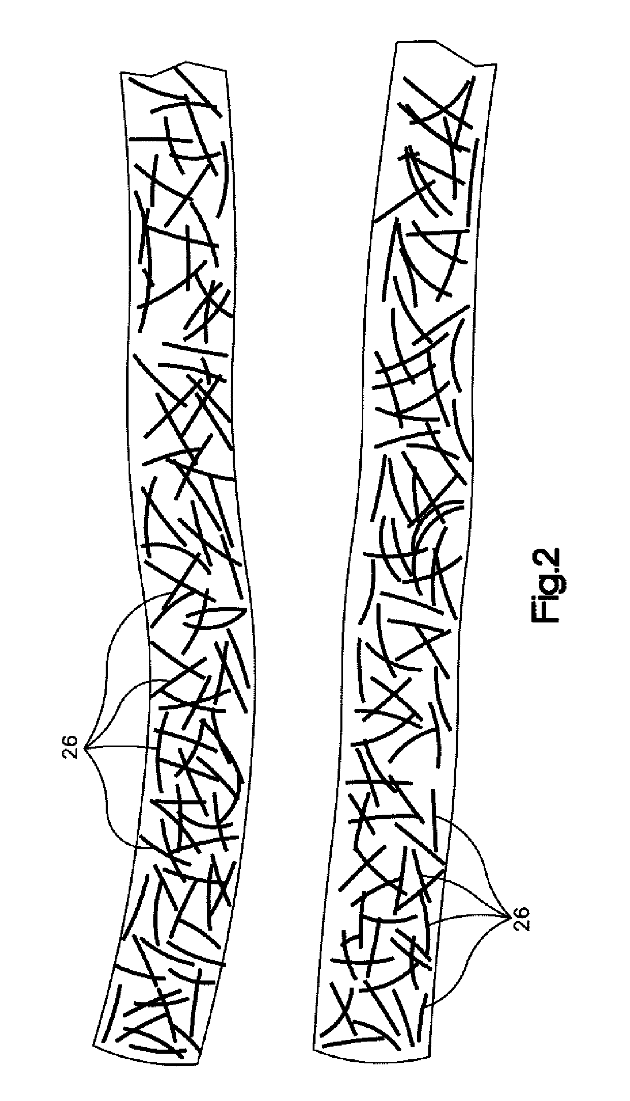 Flexible implement grip with randomly oriented cord fibers