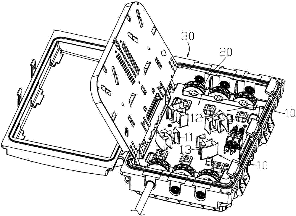 Fiber coiling and partitioning device and optical fiber laying splicing box