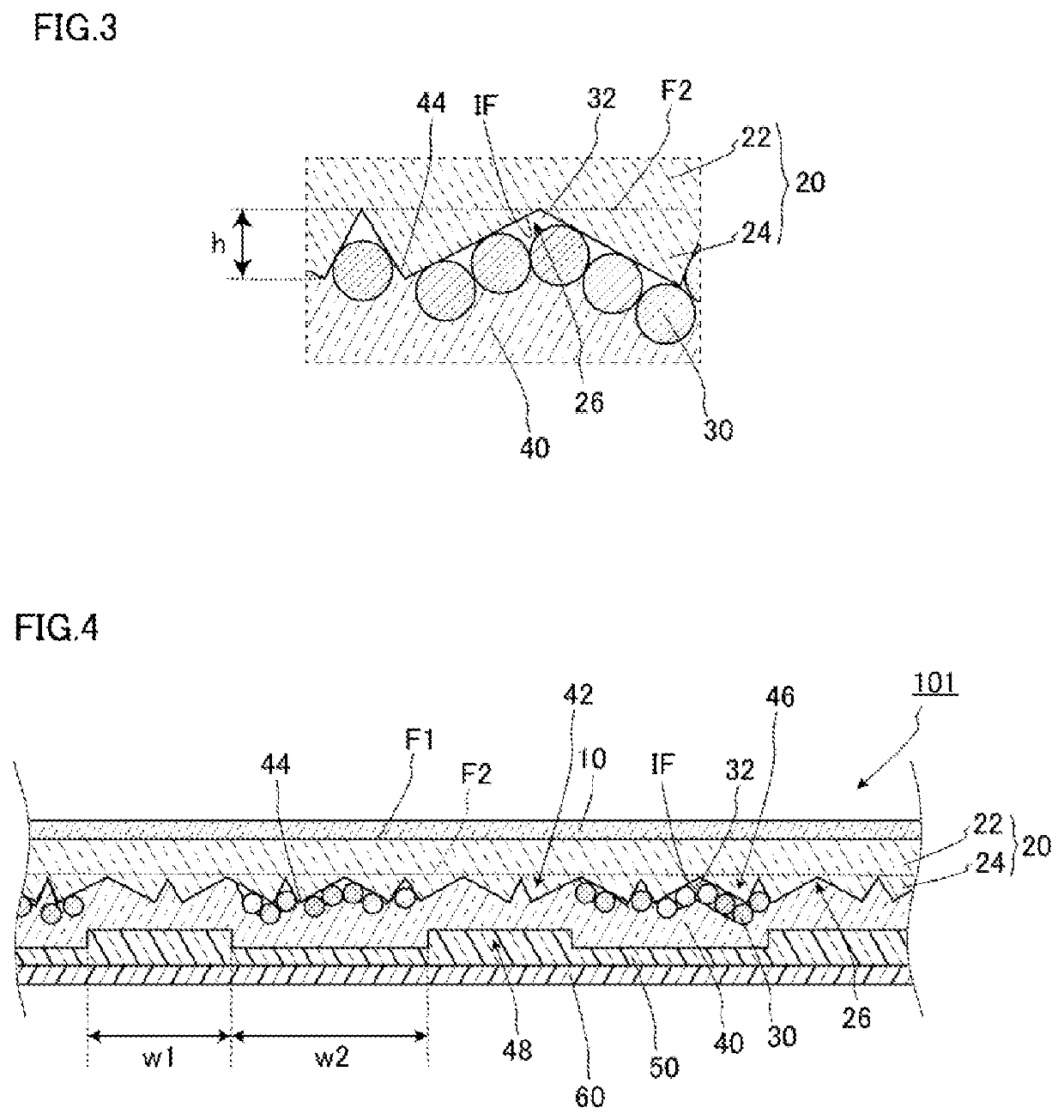 Retroreflective sheet having particles disposed between retroreflective elements and back face layer