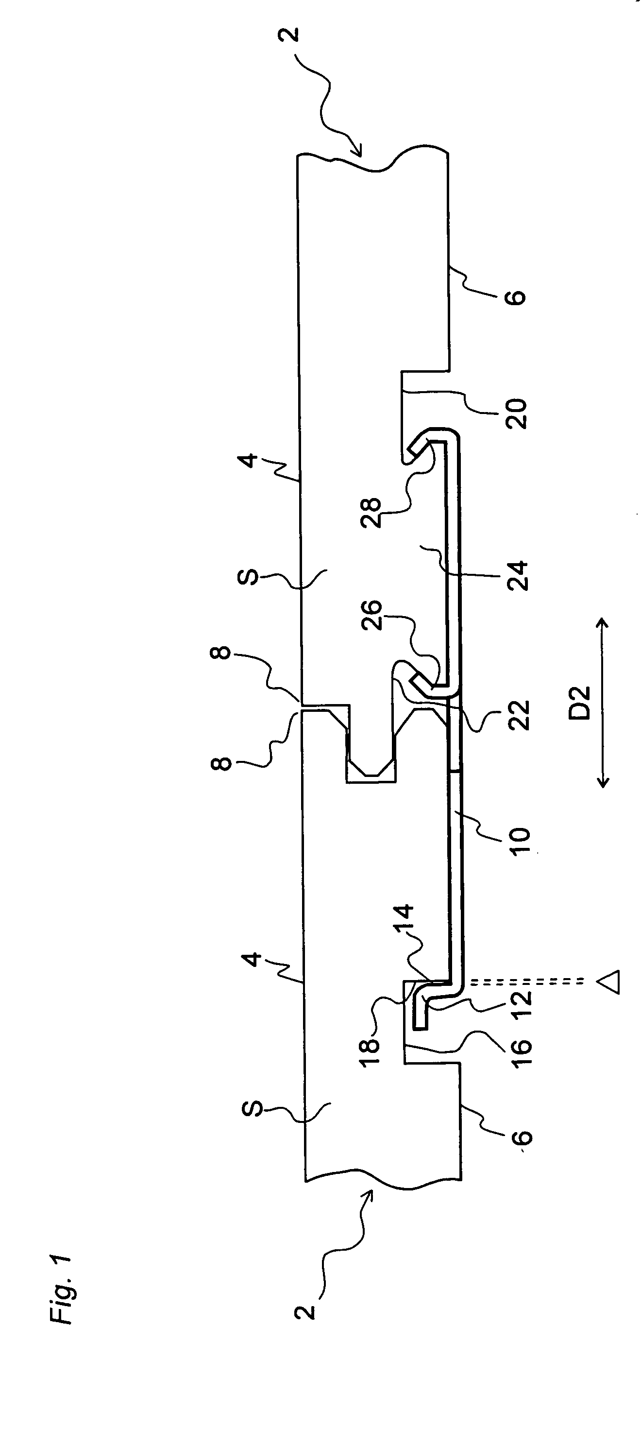 Metal strip for interlocking floorboard and a floorboard using same