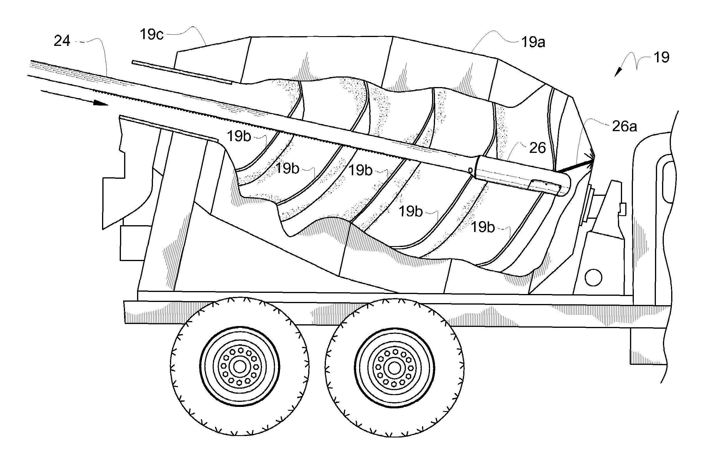 Removal of hardened concrete from ready mixed drum interiors using upwardly directed high pressure water