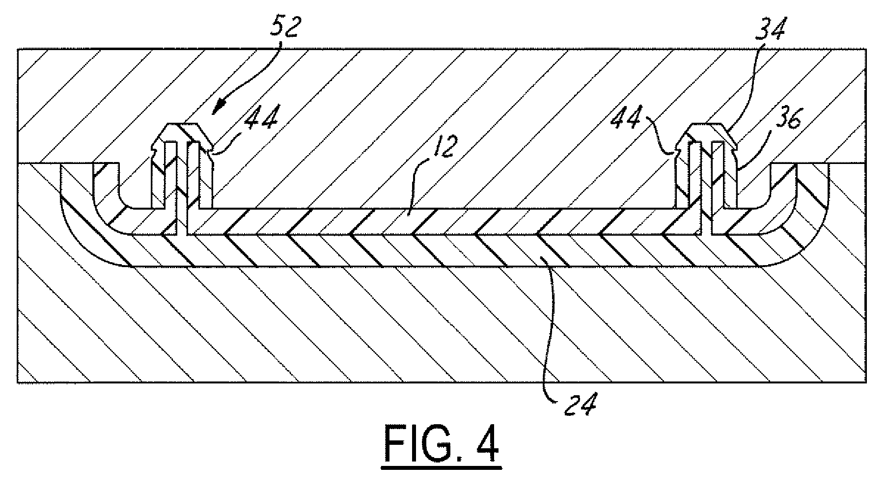 Self sealing heat stake on an overmolded panel