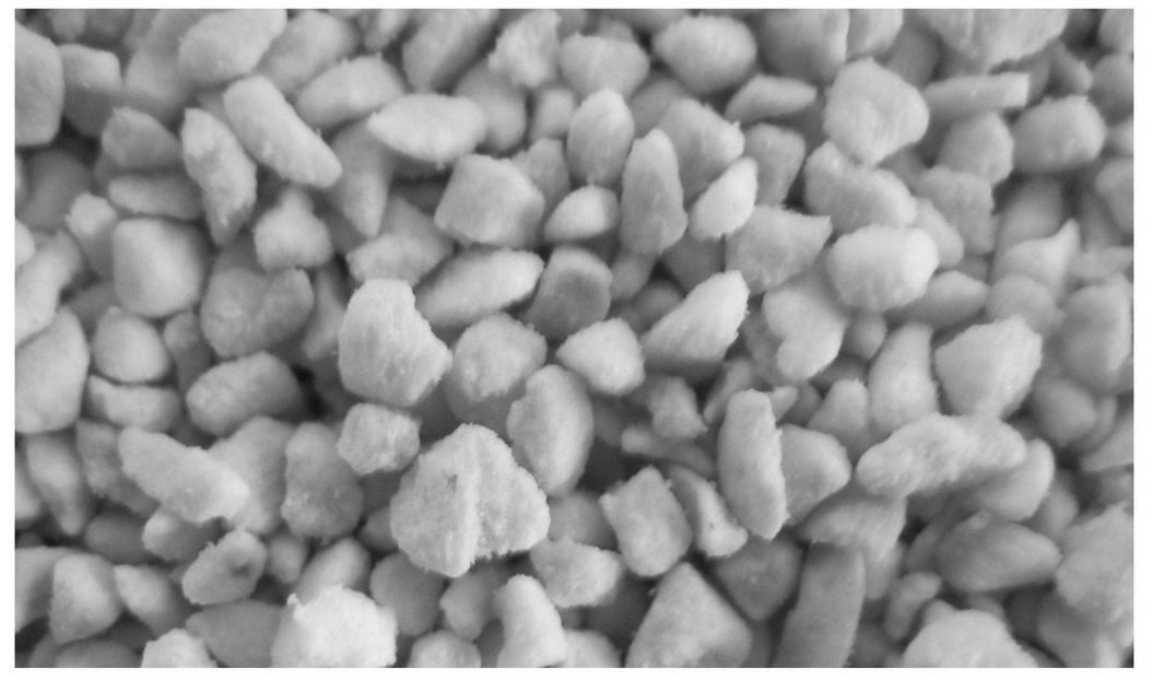 Carrier material for active ingredient of floatable agrochemical preparation and floatable agrochemical preparation