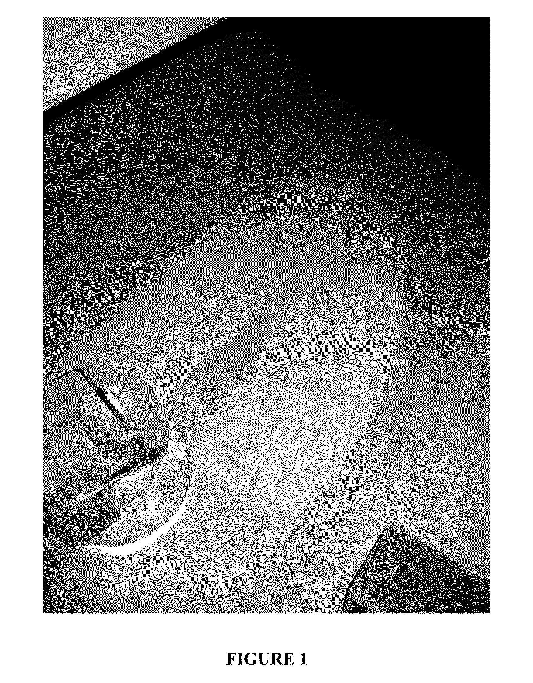 Composite material, manufacturing process therefor and uses thereof