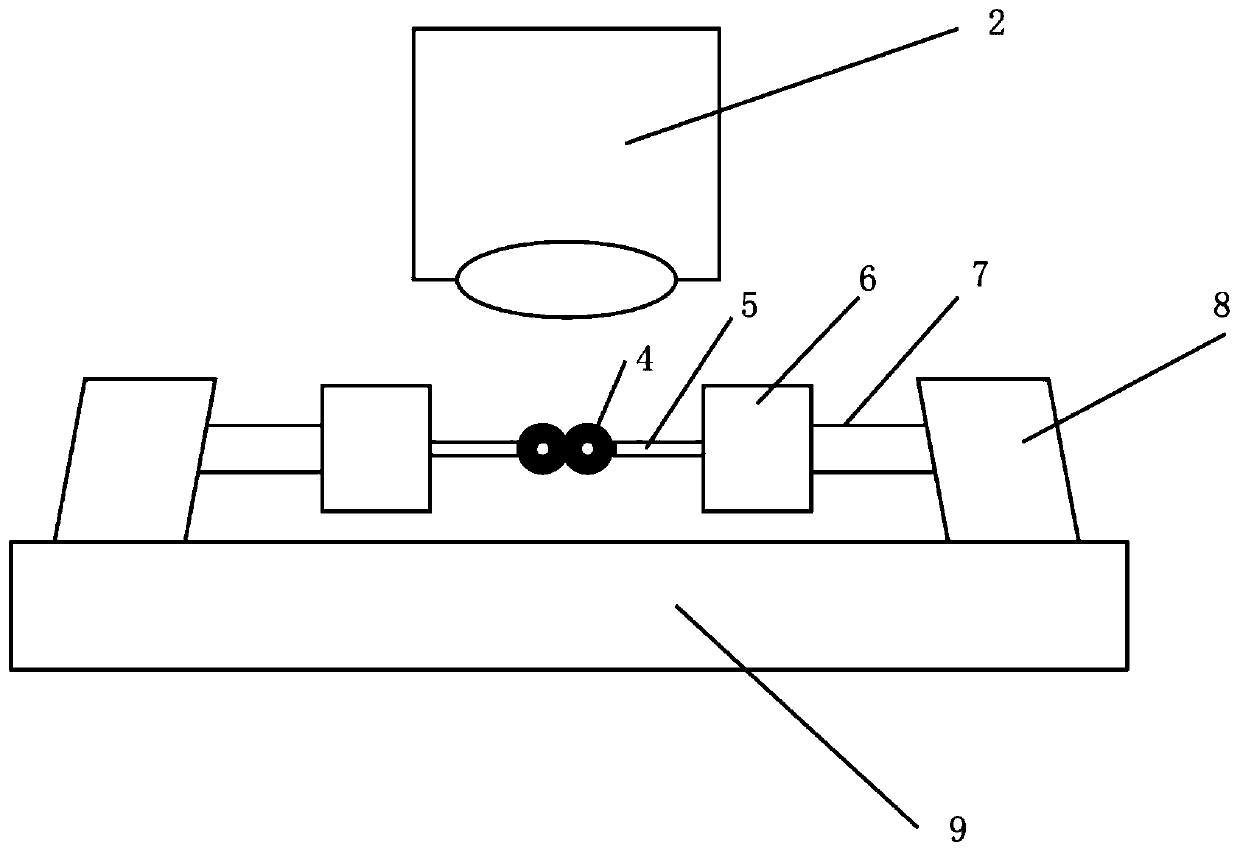 Method and device for measuring caking strength parameters of granular material through single solid bridge