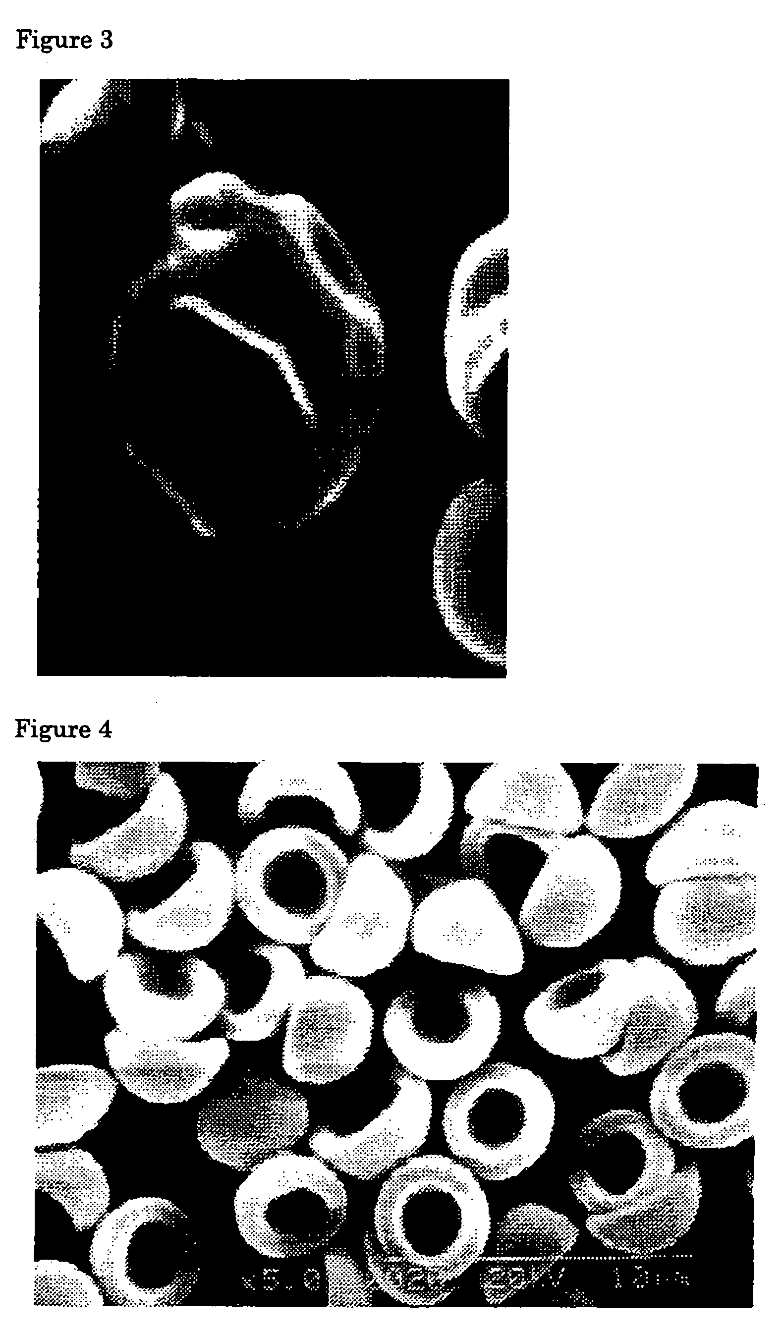 Flat particles and process for production thereof