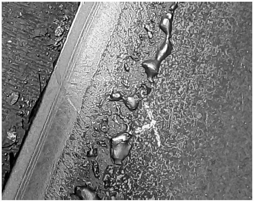 A method for controlling pinhole air bubbles under the skin of medium-carbon boron-added steel continuous casting slabs