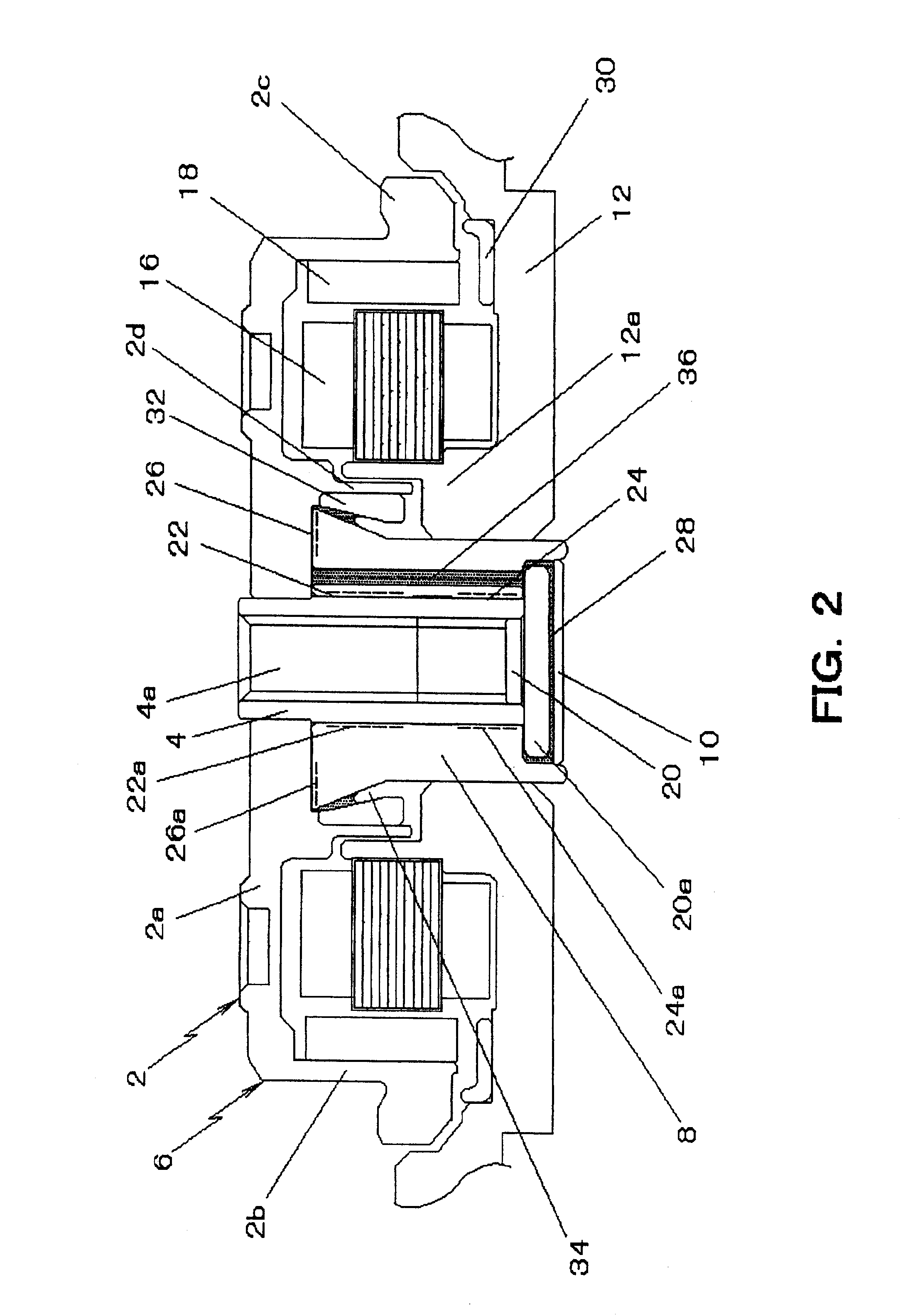 Disk drive spindle motor with radial inward thrust area annular protruding portion and bearing member communicating passage