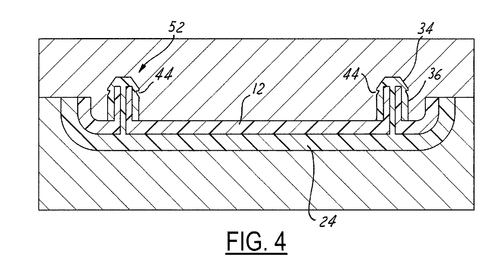 Self sealing heat stake on an overmolded panel