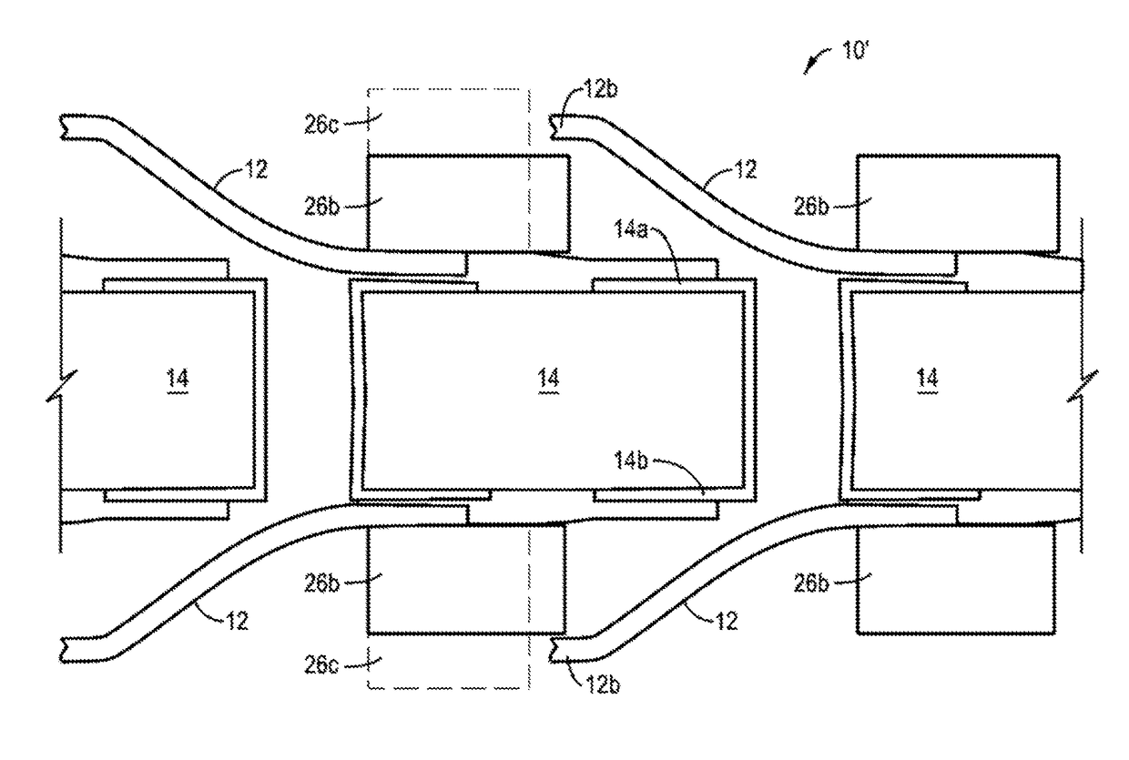 Electrical connector with electrical contacts protected by a layer of compressible material and method of making it